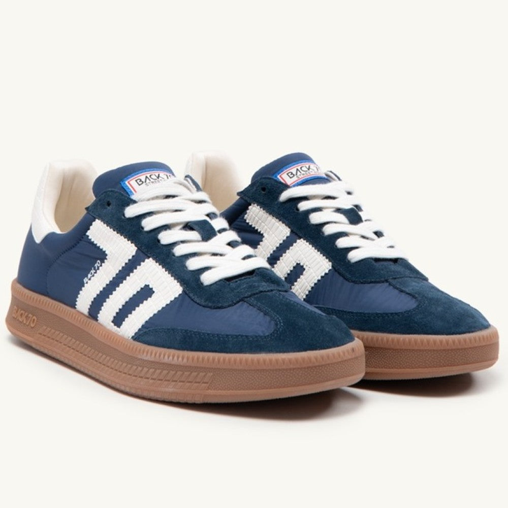 Back 70 Gents Navy blue and white sneakers with brown soles on a white background