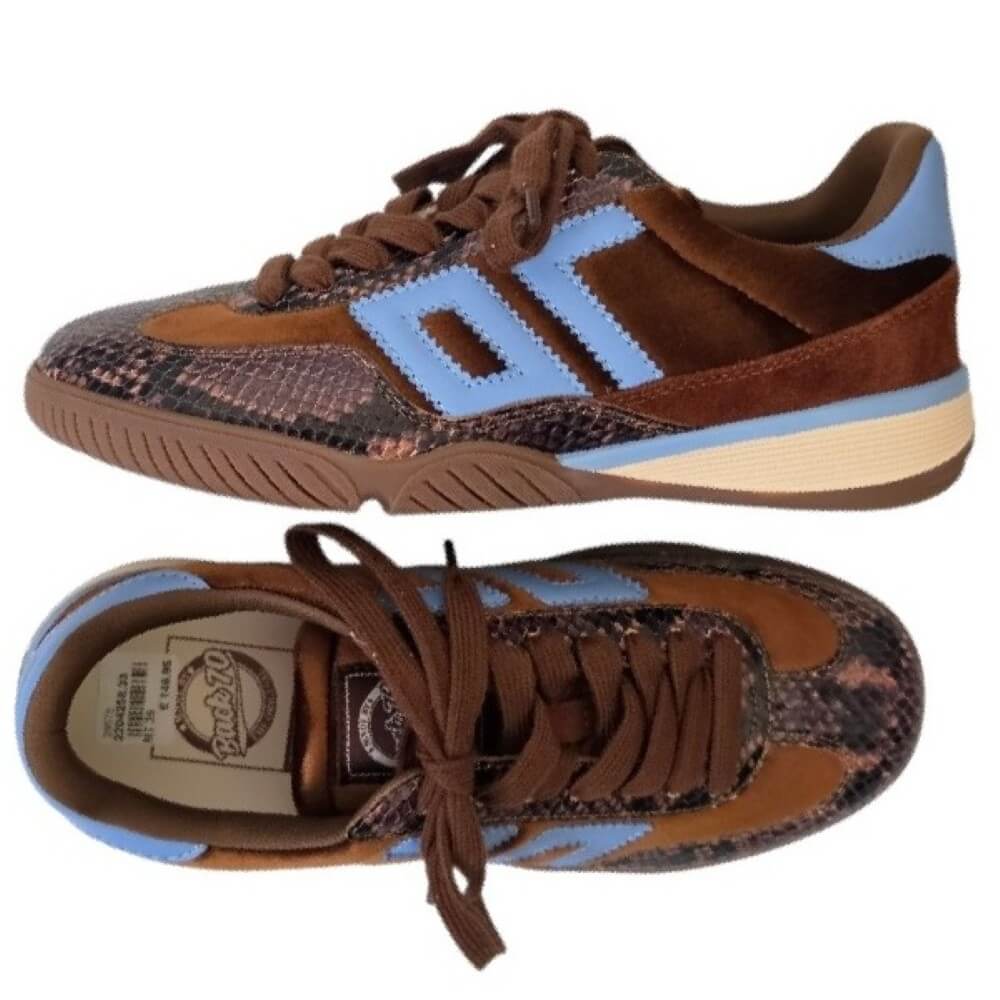 A pair of Back 70 low-top sneakers shown from the side and top views against a plain white background. The shoes feature brown suede and snakeskin-patterned panels, light blue side stripes, brown laces, and a beige midsole.