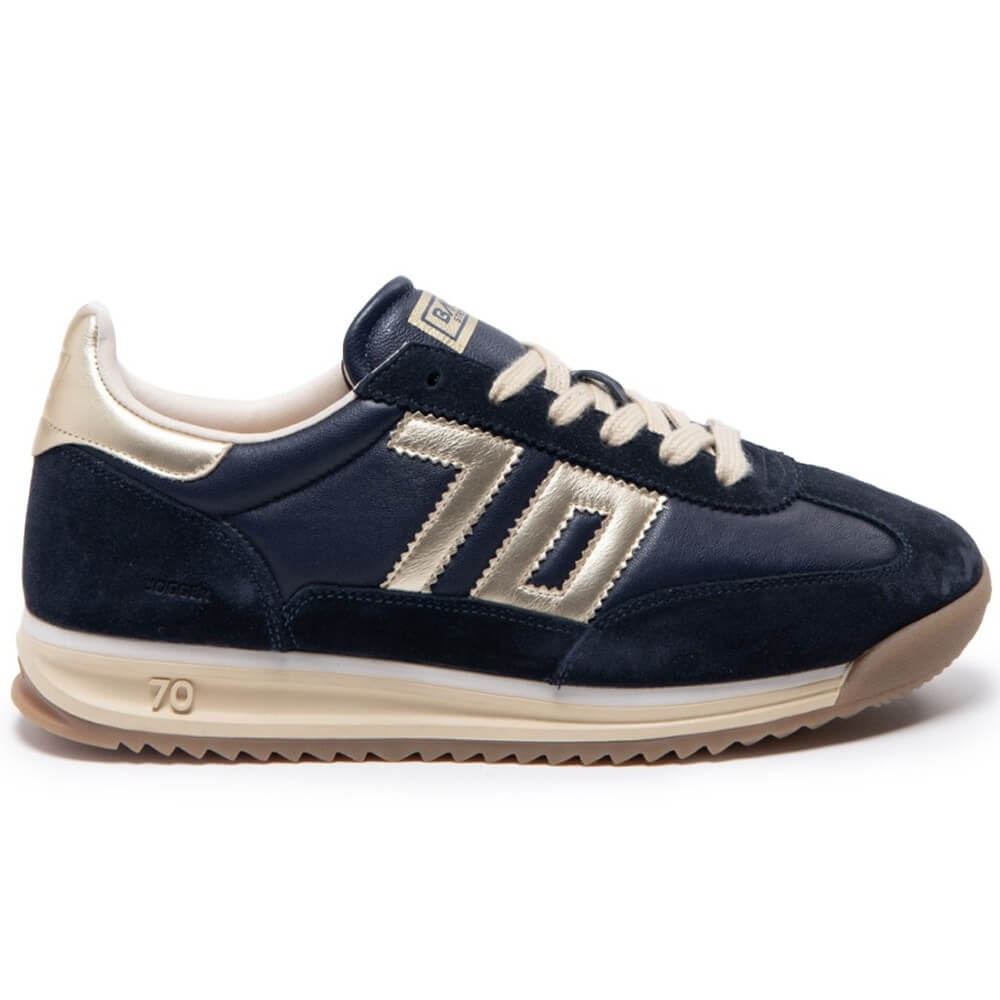 Navy blue sneaker with gold accents on a white background Back 70 Jogger N03 Navy Leather features a soft padded leather