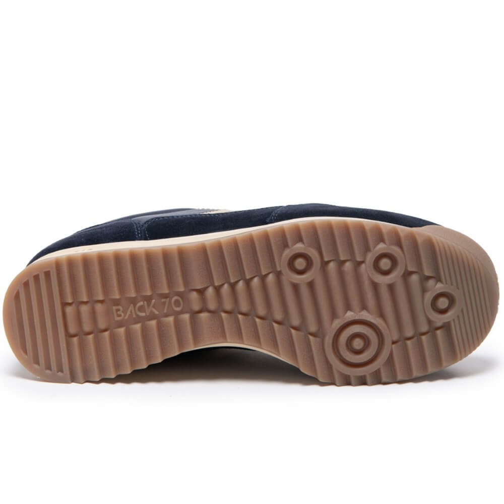 Navy blue sneaker with gold accents on a white background Back 70 Jogger N03 Navy Leather features a soft padded leather