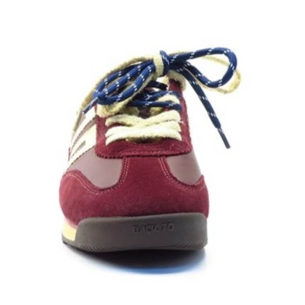 A single Back to shoe shown from the front, featuring a burgundy suede upper, beige leather panels, cream laces with blue stripes, and a dark grey sole.