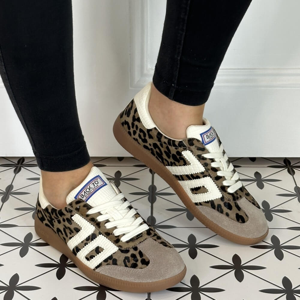 Leopard print sneakers with white accents worn indoors on a patterned floor. Back 70 Cloud Retro Sneaker in Leopard with Milk