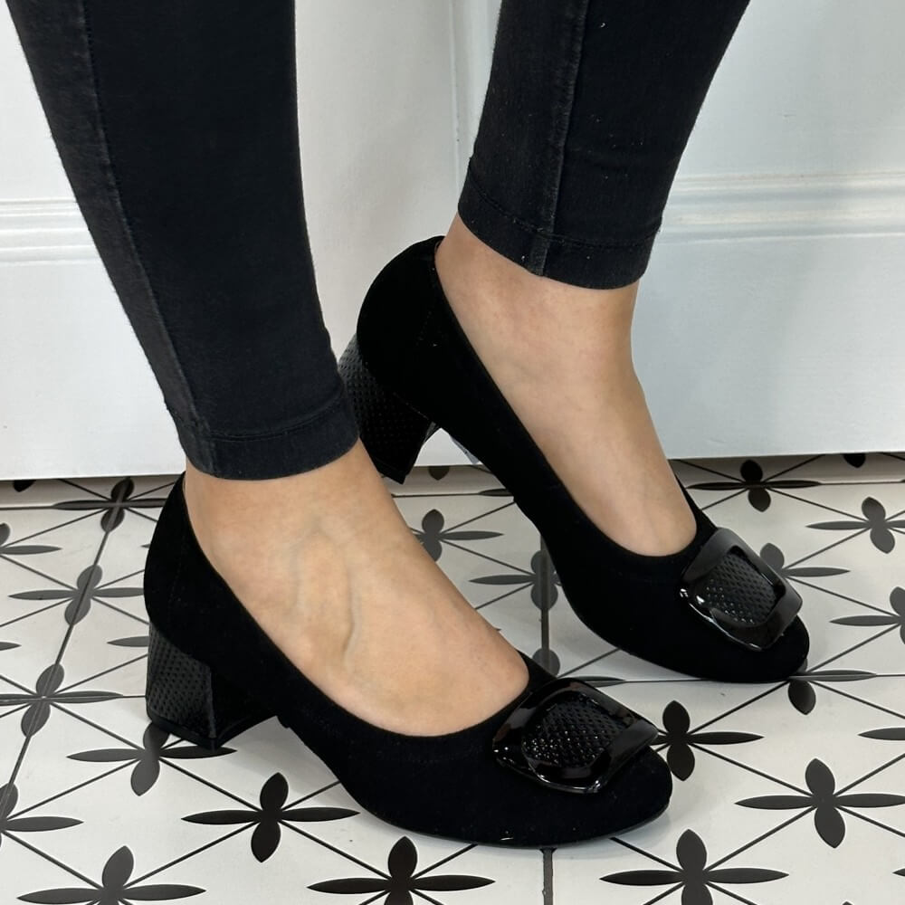 Black shoes with buckles worn by a person on a patterned floor. Bioeco 6883 H Fit Block Heel Black Suede