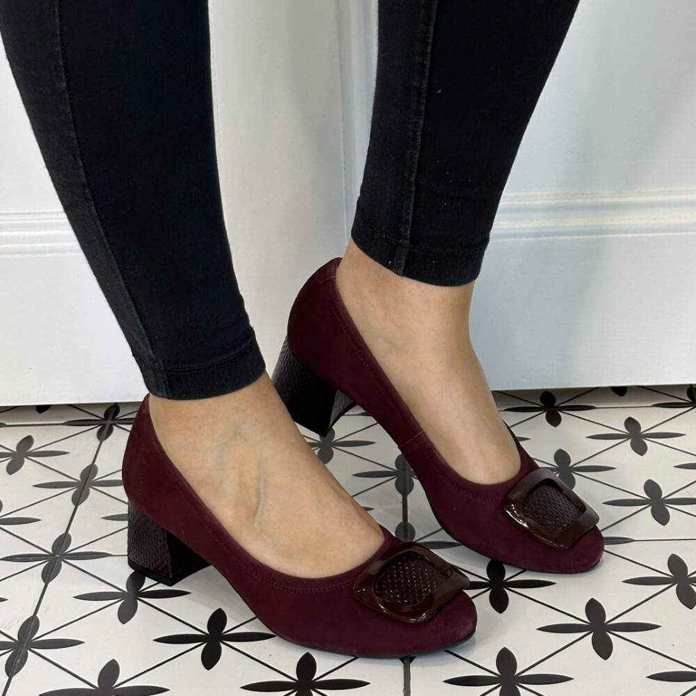 Burgundy shoes with a block heel worn by a person on a patterned floor. Bioeco 6883 H Fit Block Heel Burgundy Suede