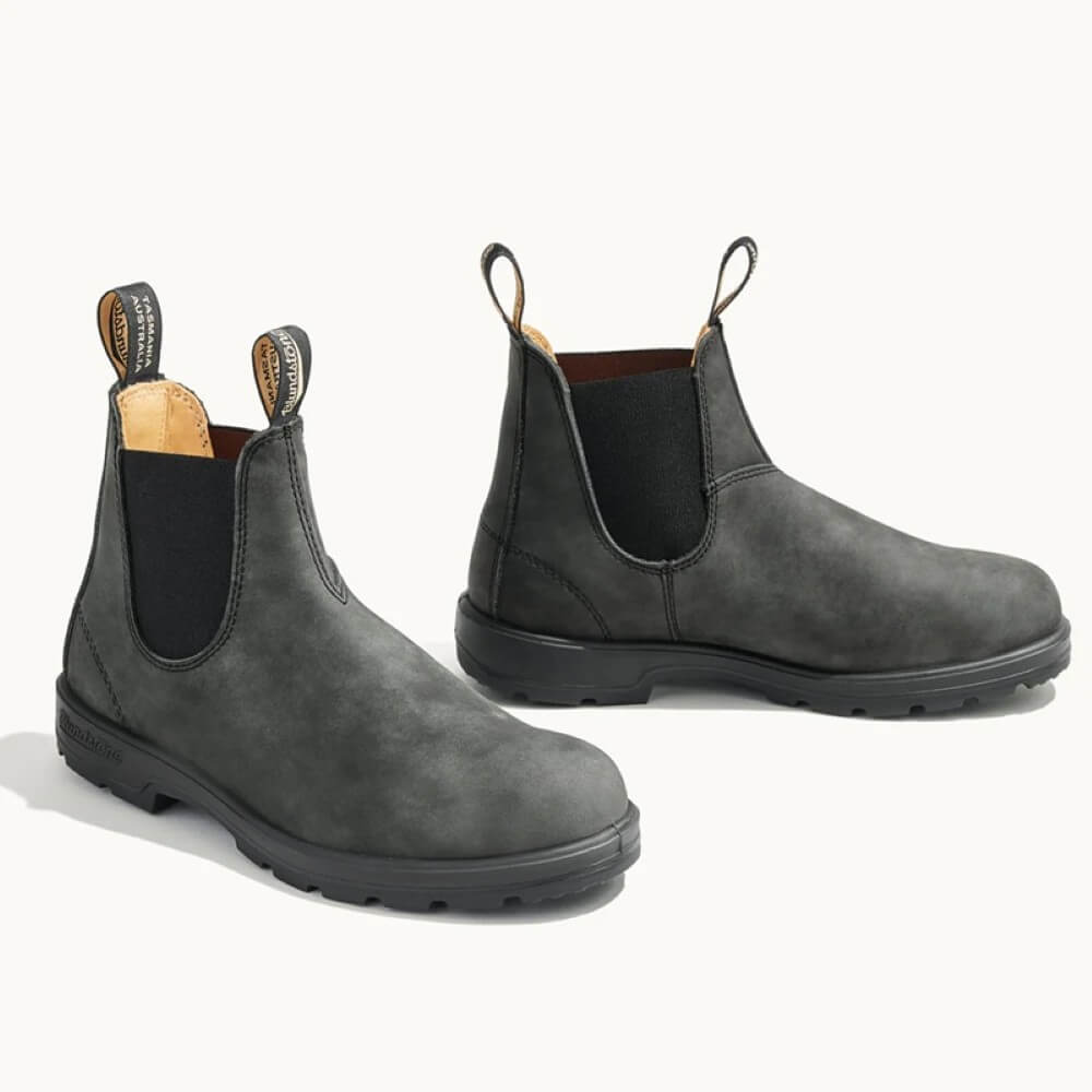 Pair of Black leather Chelsea boots on a white background