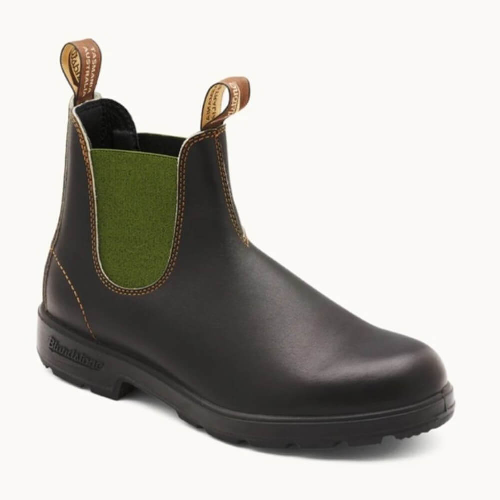 Brown Chelsea boot with green inner lining on a white background