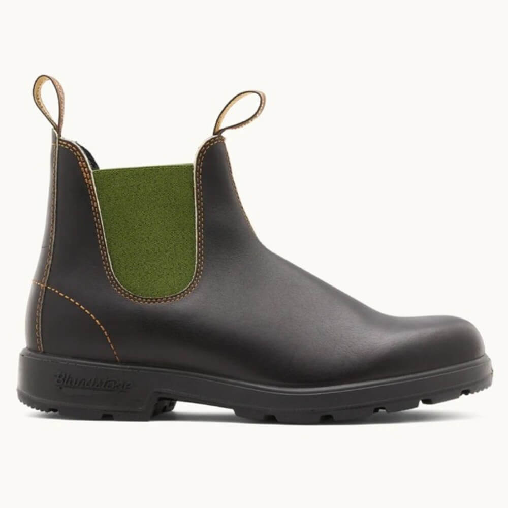 Brown Chelsea boot with green inner lining on a white background