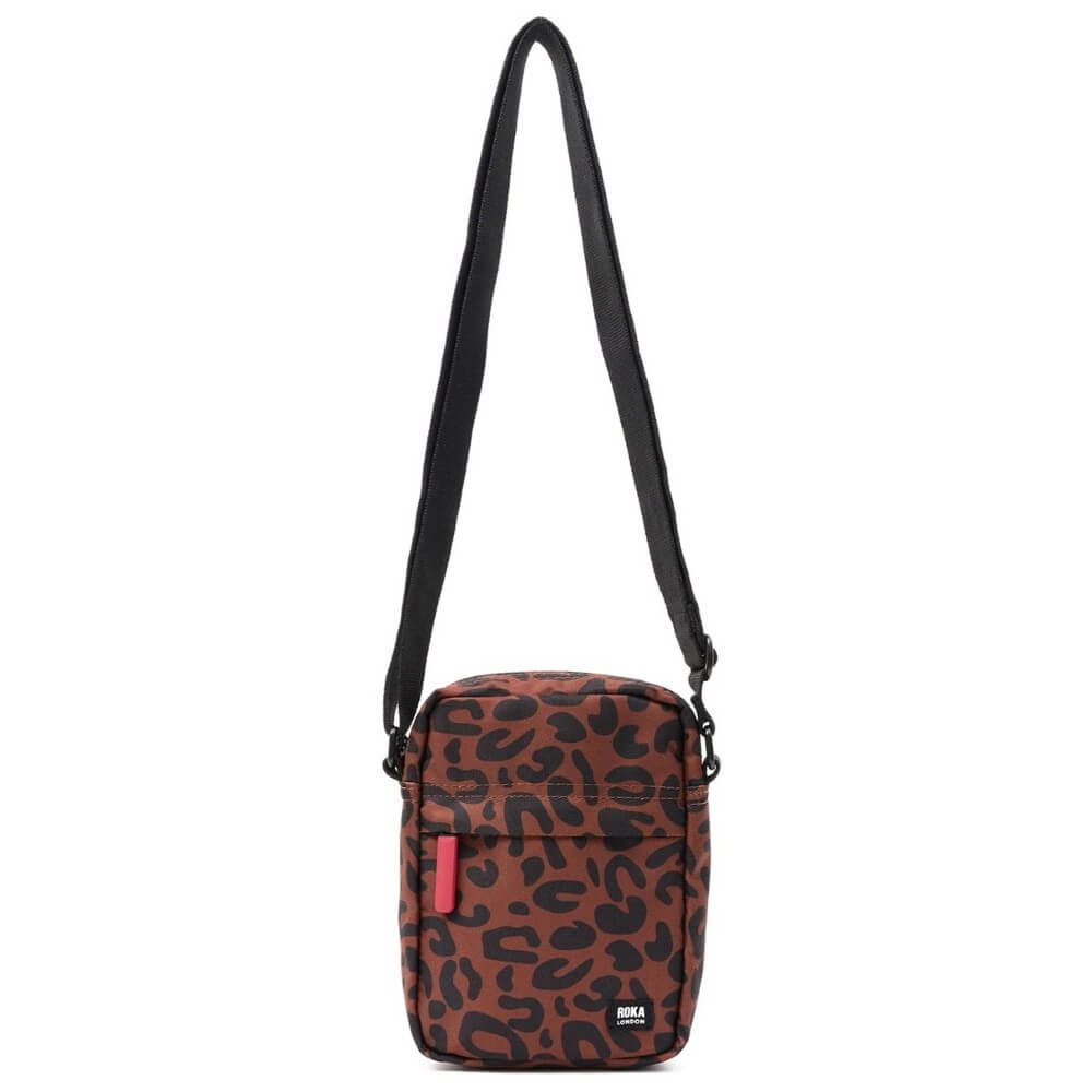 Crossbody bag with leopard print pattern on a white background