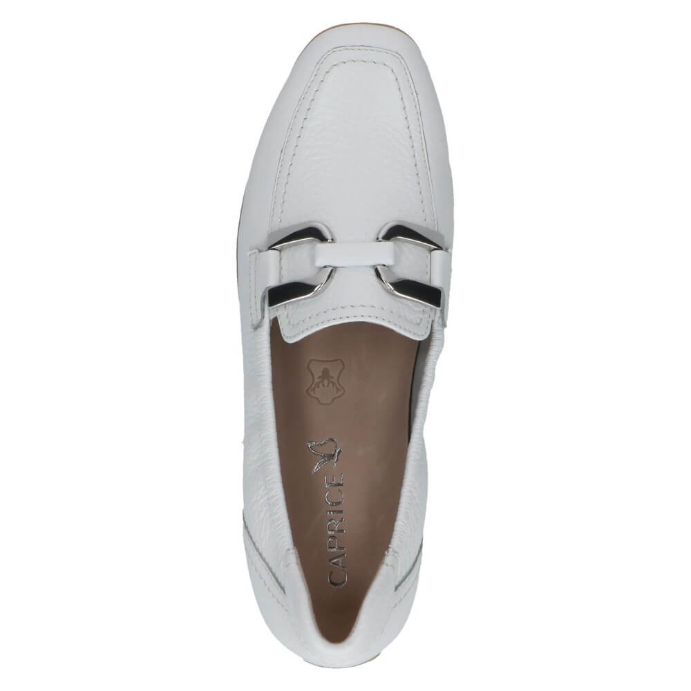 White loafer shoe with a bow detail on a white background