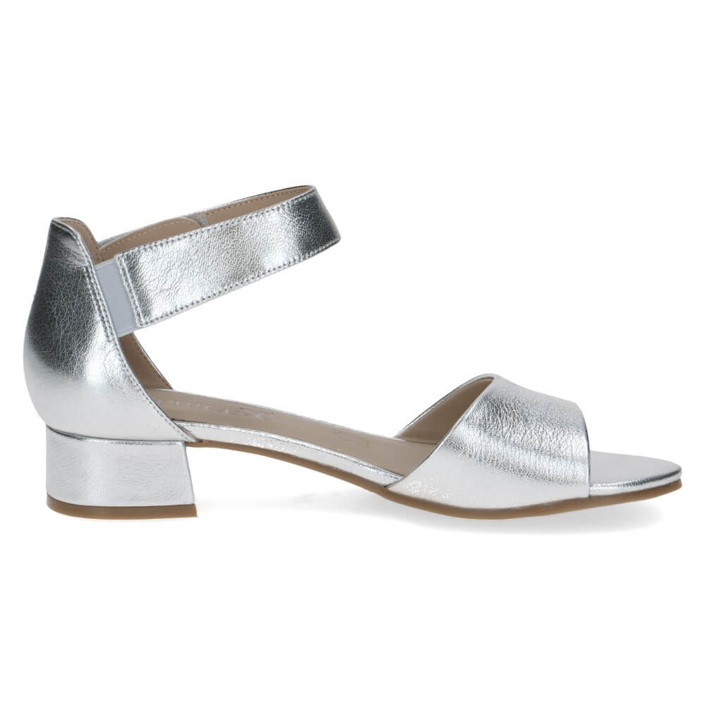 Silver sandal with a block heel on a white background