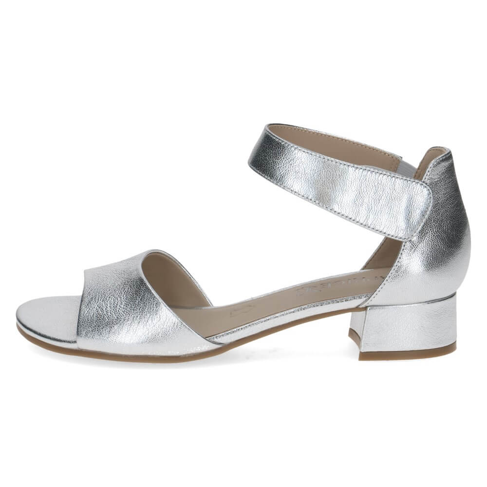 Silver sandal with a block heel on a white background