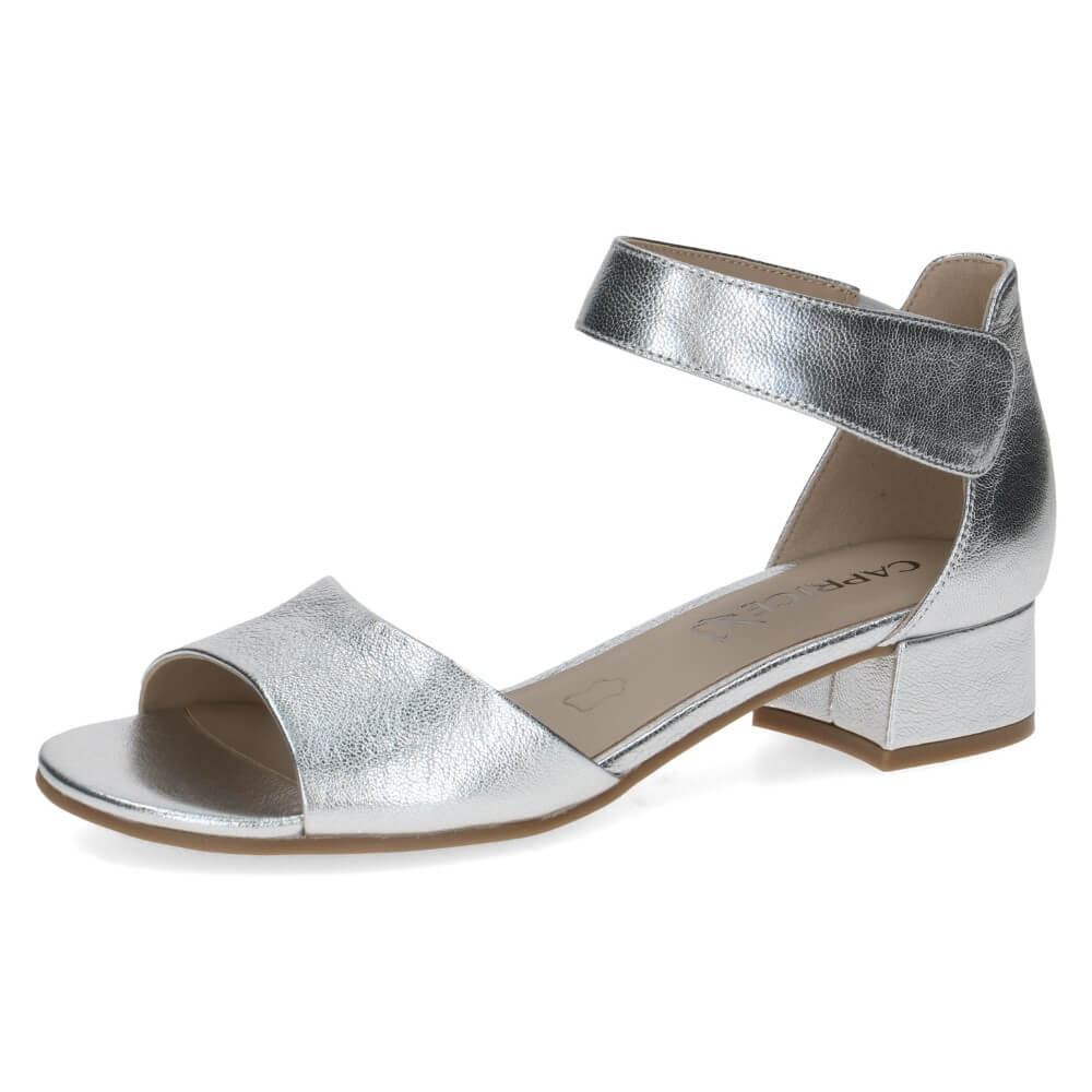 Silver sandal with a block heel on a white background