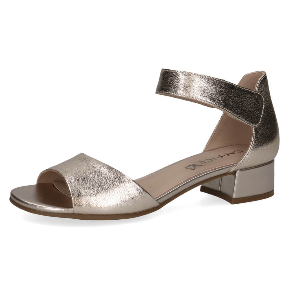 Gold metallic sandal with block heel on a white background