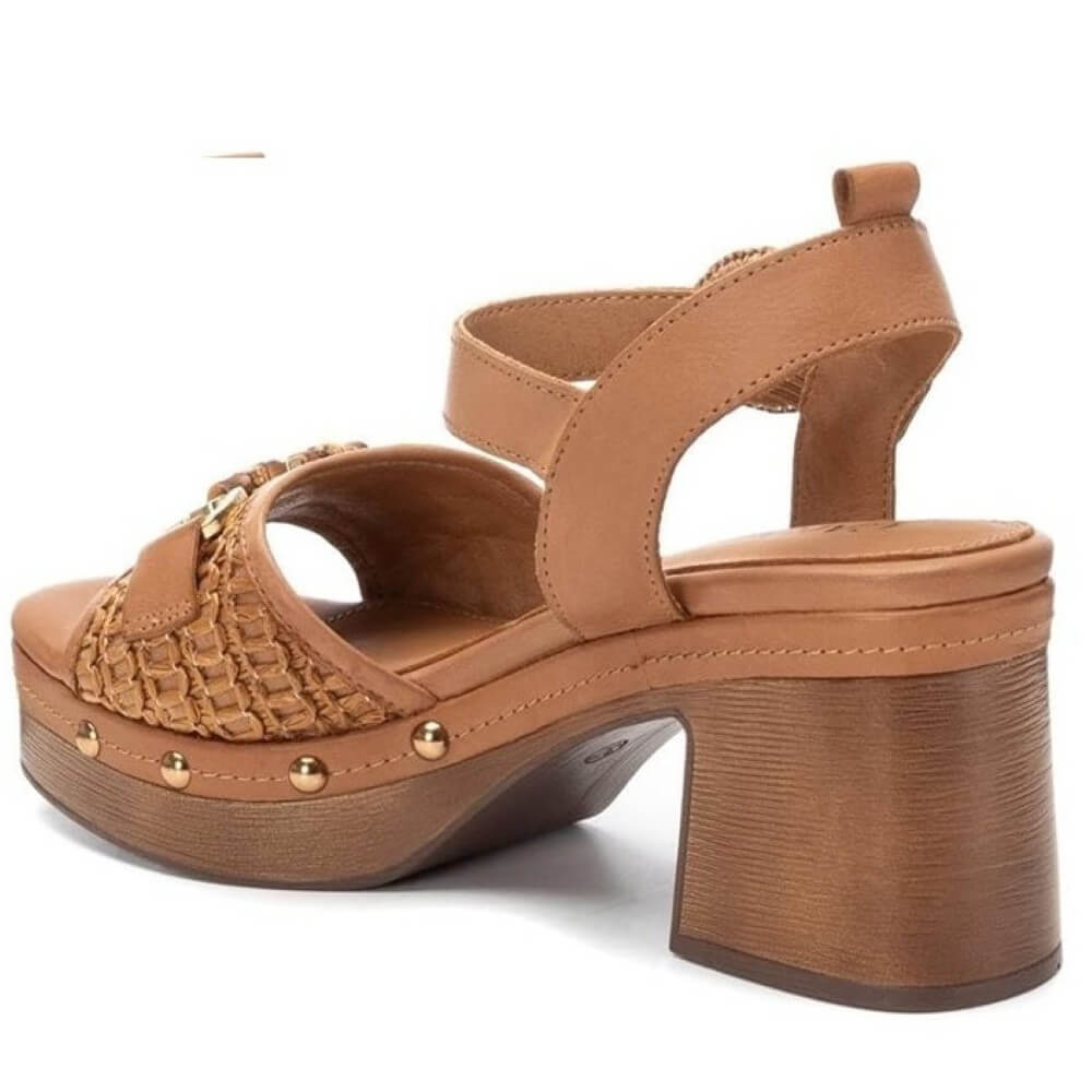 Brown sandal with wooden block heel on a white background