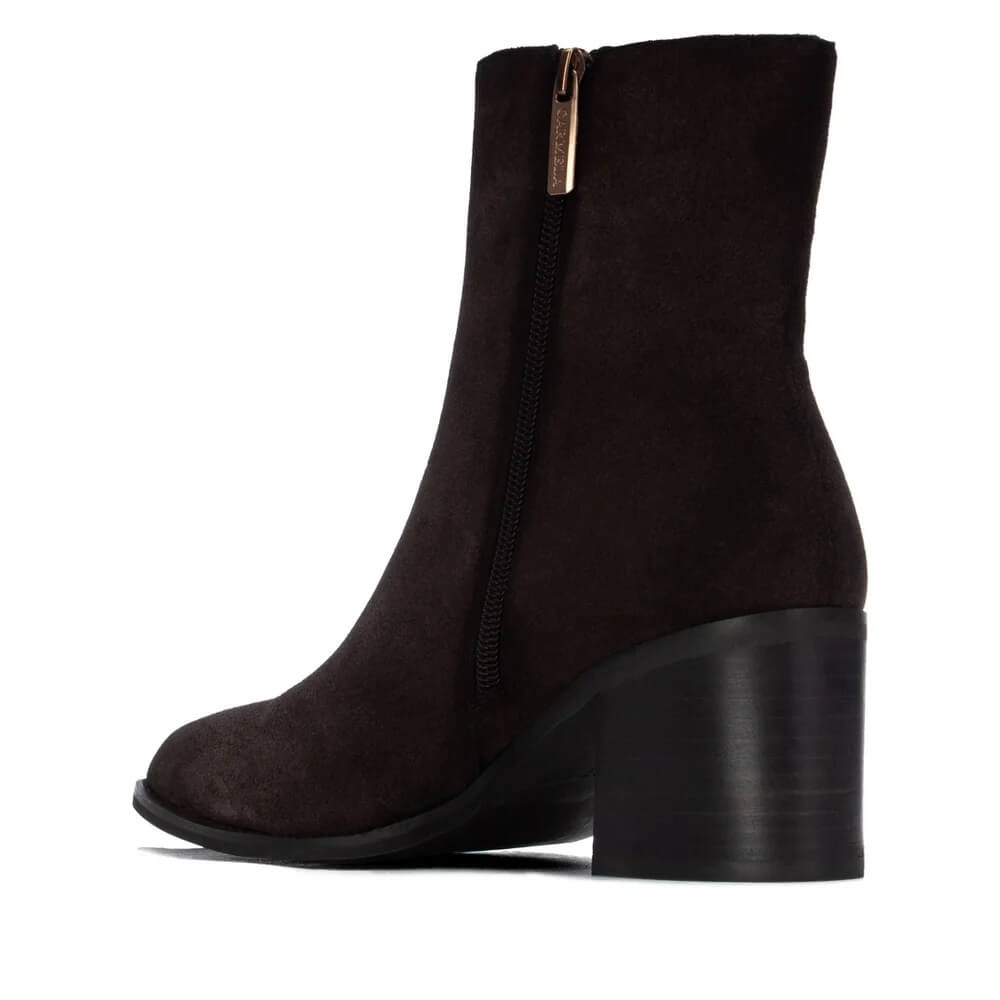 Carmela Dark Brown Suede Block heel ankle boot with a pointed toe on a white background