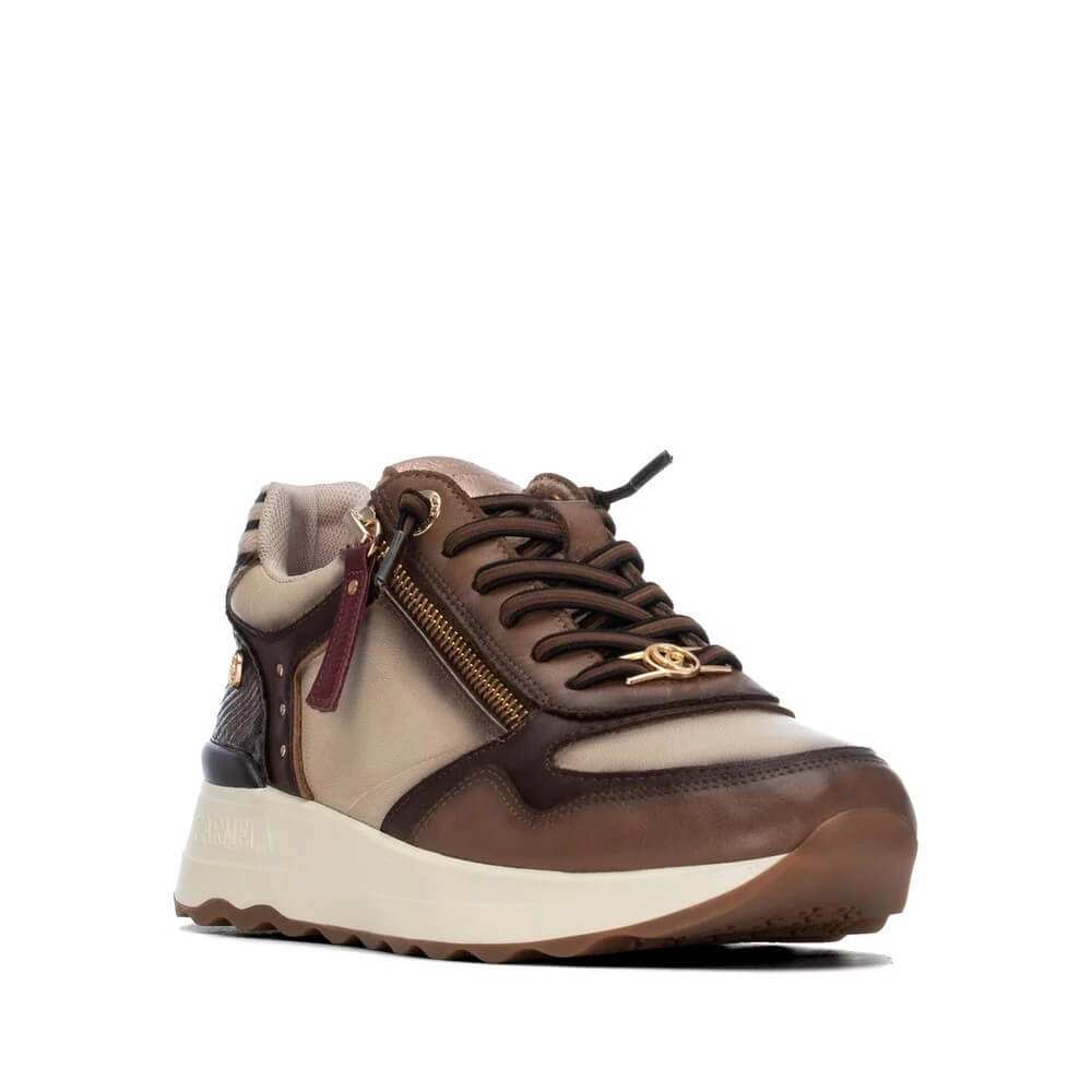 A Carmela brown and beige leather sneaker with a cream-colored midsole, gold-tone hardware, and a side zipper, shown on a plain white background.