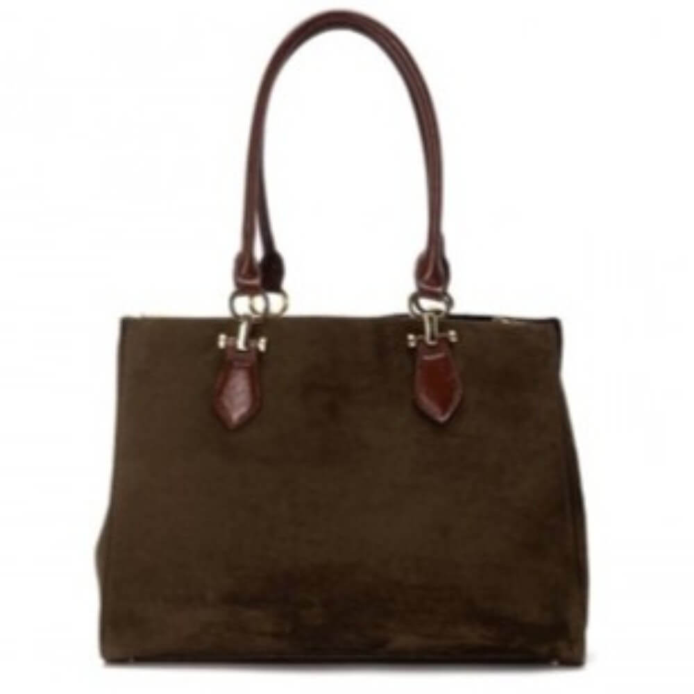 green handbag with leather accents on a white background