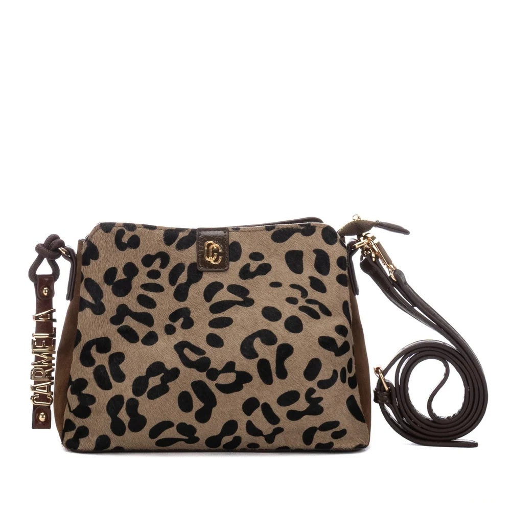 A Carmela leopard print shoulder bag with a tan and black pattern, featuring a gold-tone logo clasp and a matching leather strap with a hanging charm.