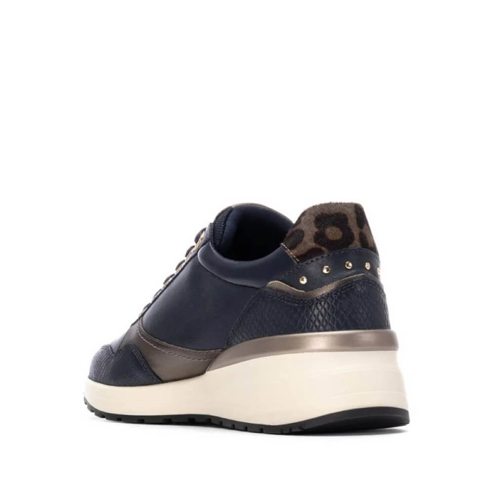 Navy blue sneaker with gold accents on a white background Carmela Leather Trainer 162442-NAVY