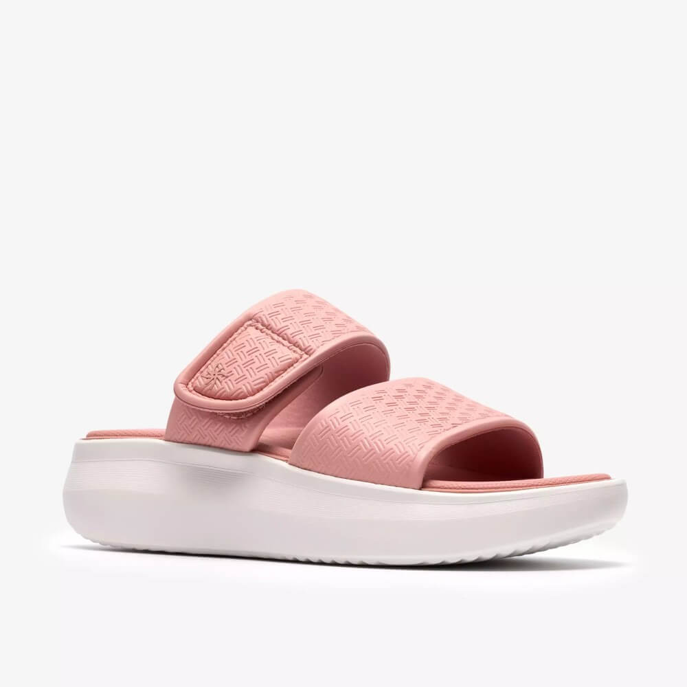 Clarks Pink slide sandal with white sole on a light Grey background