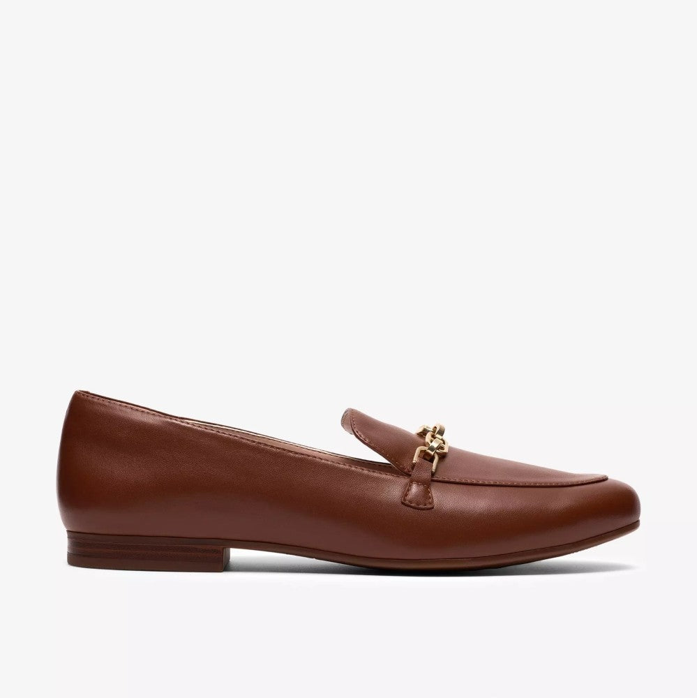 Clarks Brown loafer shoe with a gold buckle on a white background