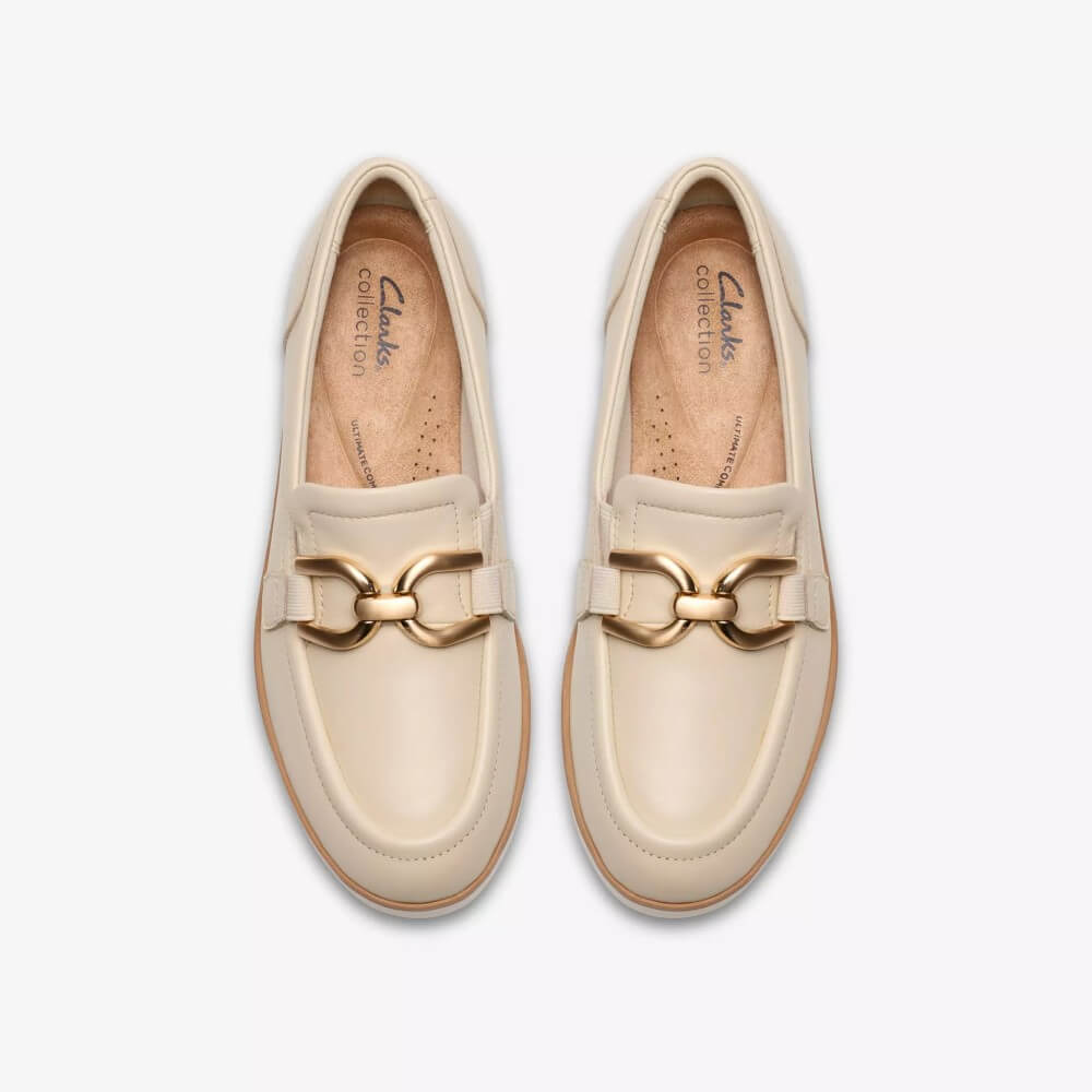 Clarks Beige loafers shoes with a gold buckles on a white background