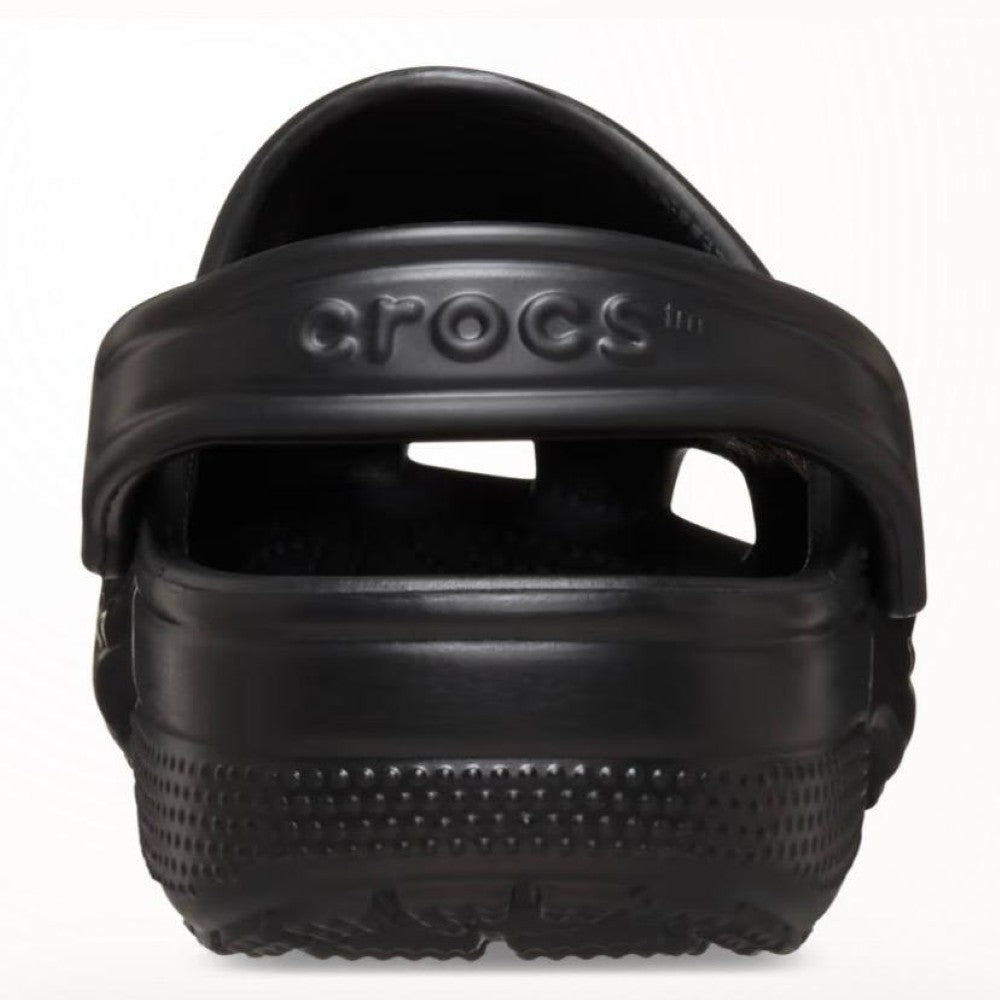 Black Crocs sandal on a white background