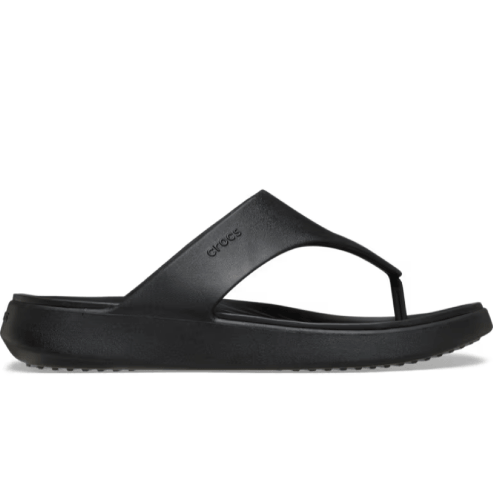 Black sandal with 'Crocs' branding on a white background