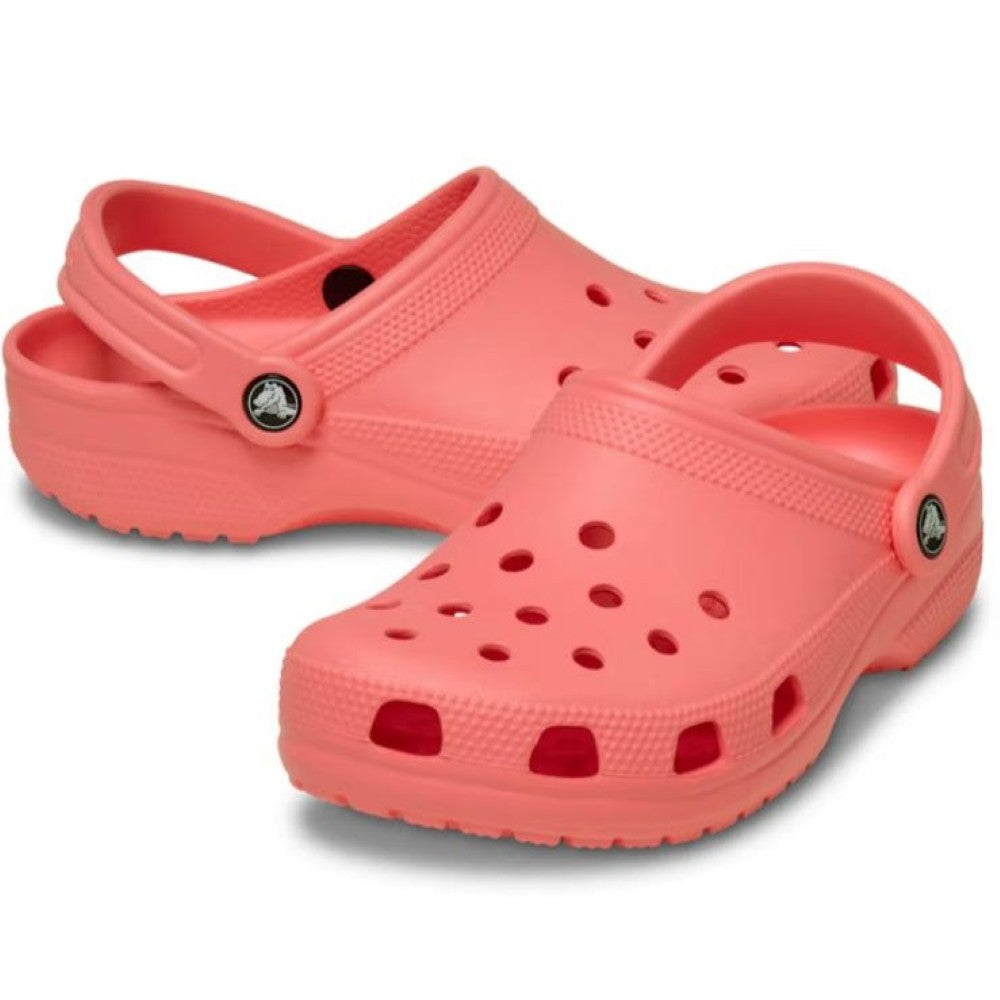 Pair of Crocs Classic guava pink on a white background