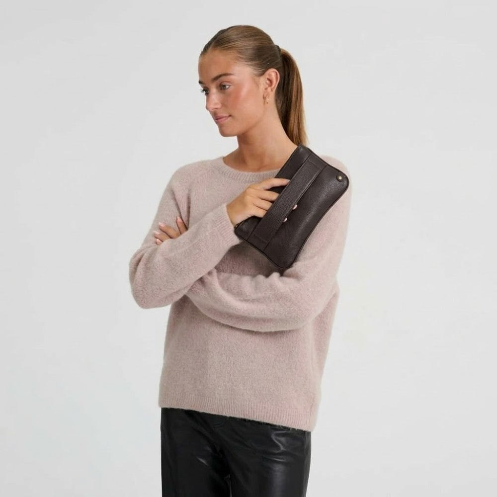 Person holding a Depeche Brown Leather Clutch bag  