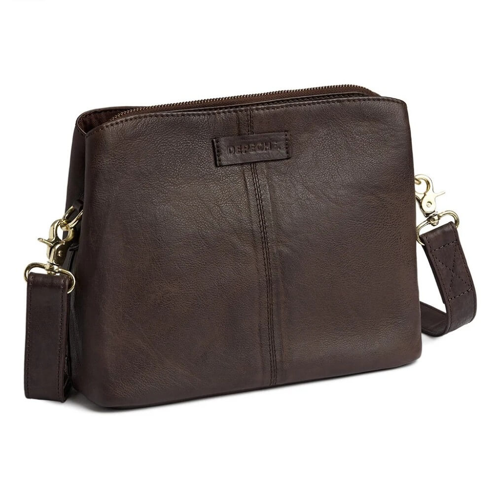 A Depeche dark brown leather crossbody bag with a top zipper, a front vertical seam, and gold-tone hardware, shown on a plain white background.