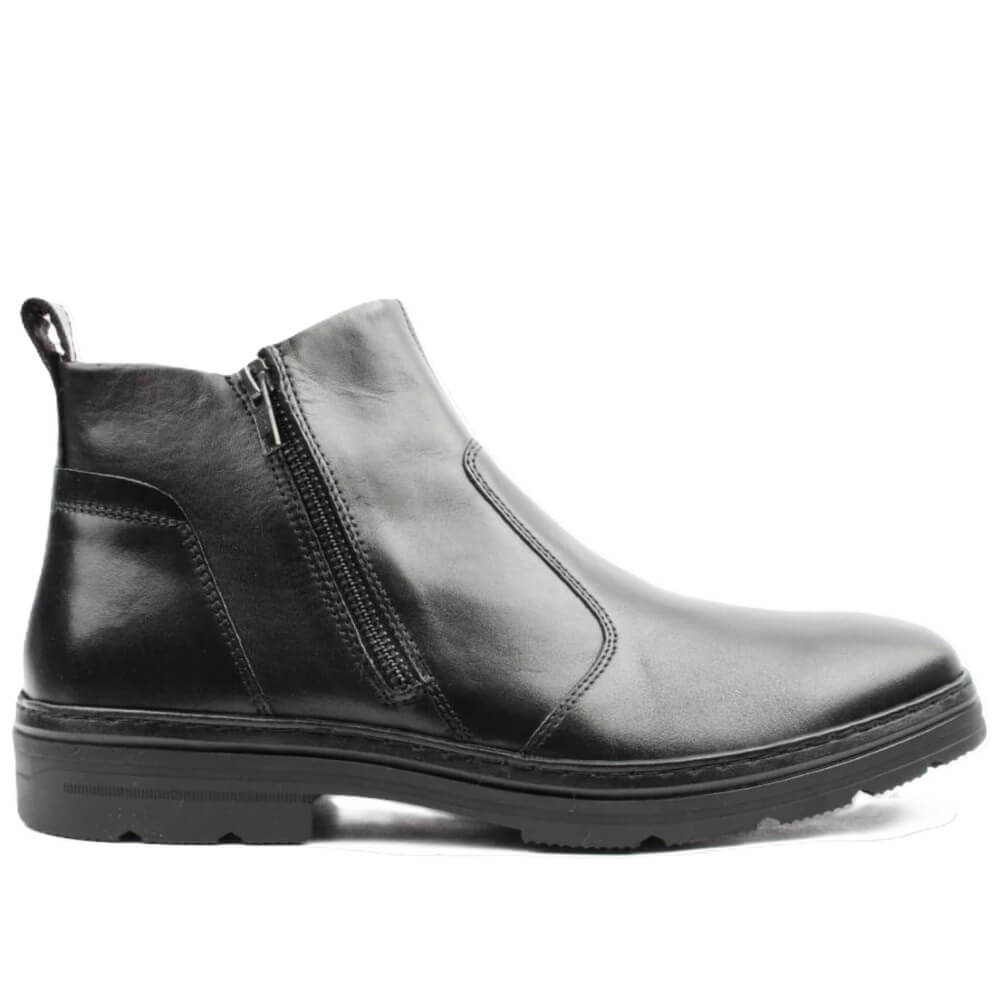 A Dubarry black leather Chelsea-style ankle boot with a side zipper, elastic side gore, pull tab, and chunky lug sole, shown in profile against a white background.