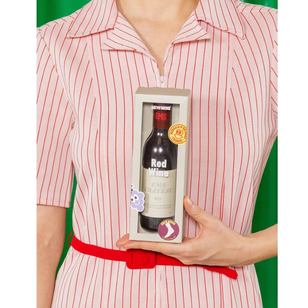person holding Pair of socks in a wine bottle