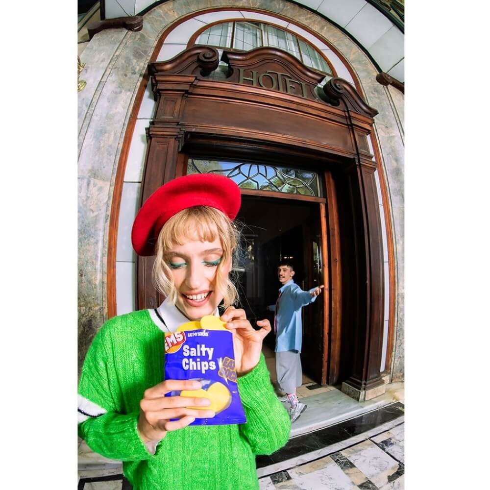 person holding a bag that looks like crisps