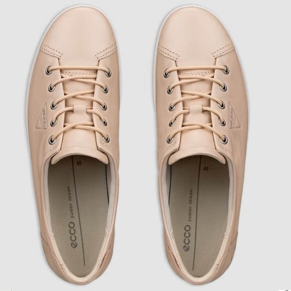 Pair of ECCO beige sneakers on a light grey background
