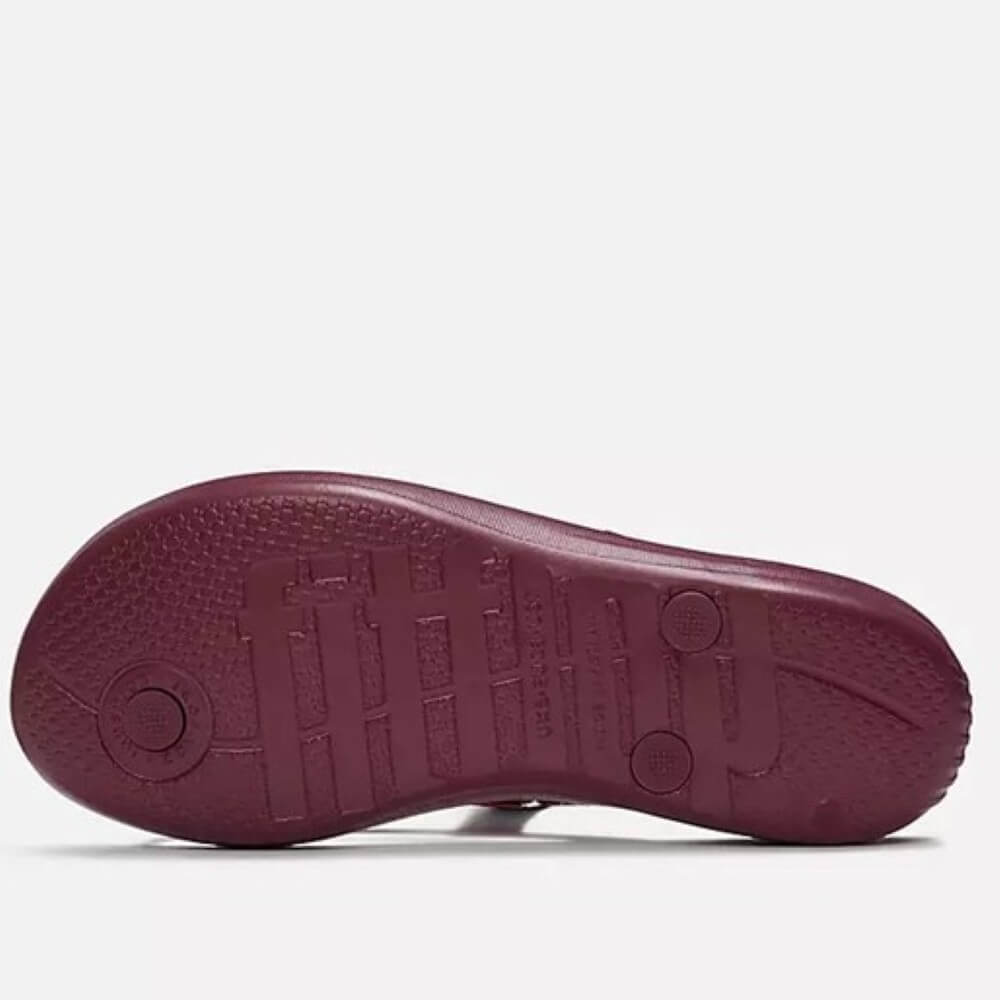 Wine sole of a Fitflop on a white background