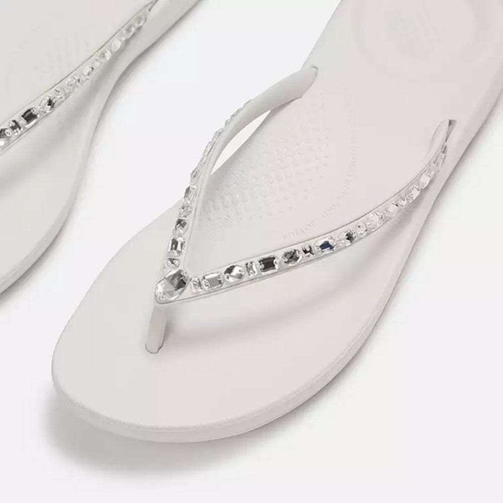 Fitflop White sandal with a decorative strap on a white background