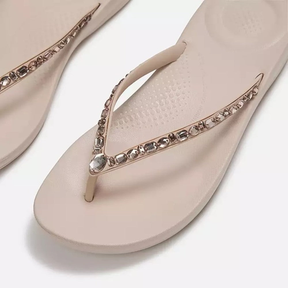 Fitflop nude rose toe-post sandal with embellishments on a white background