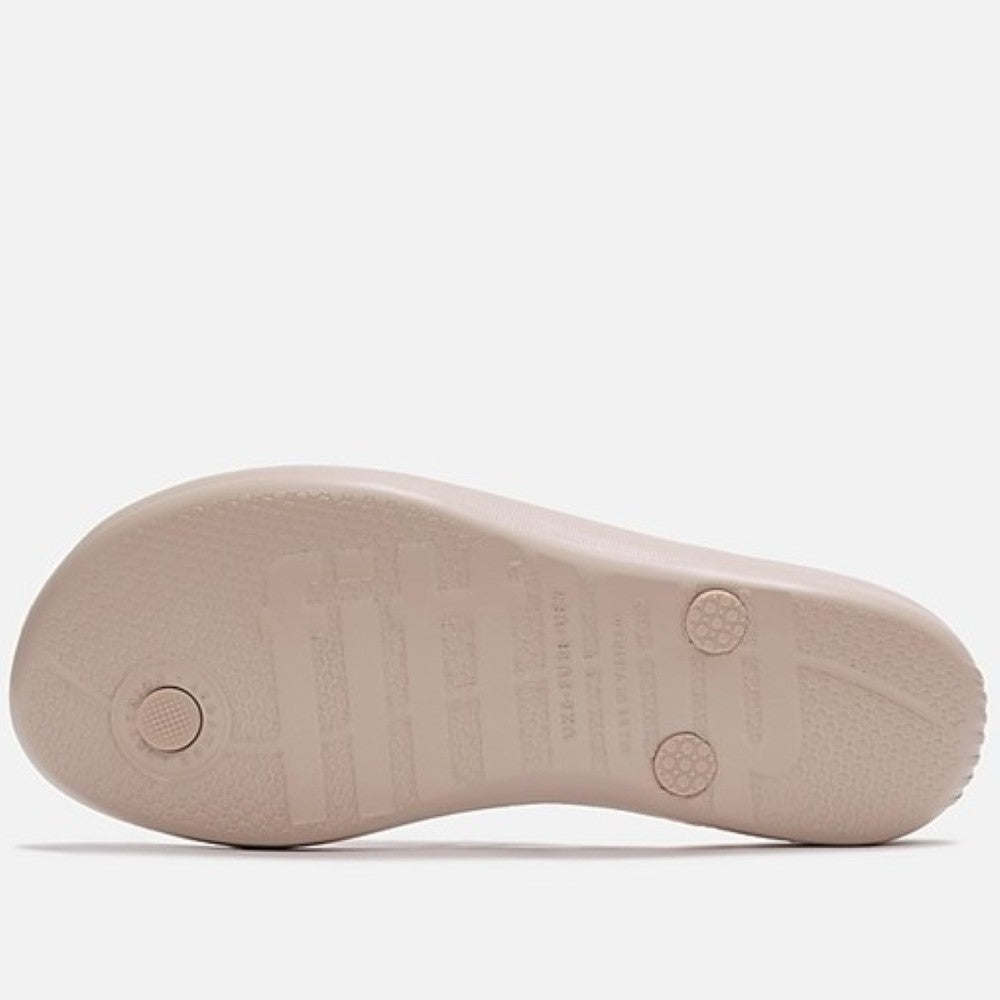 Fitflop nude rose toe-post sandal with embellishments on a white background