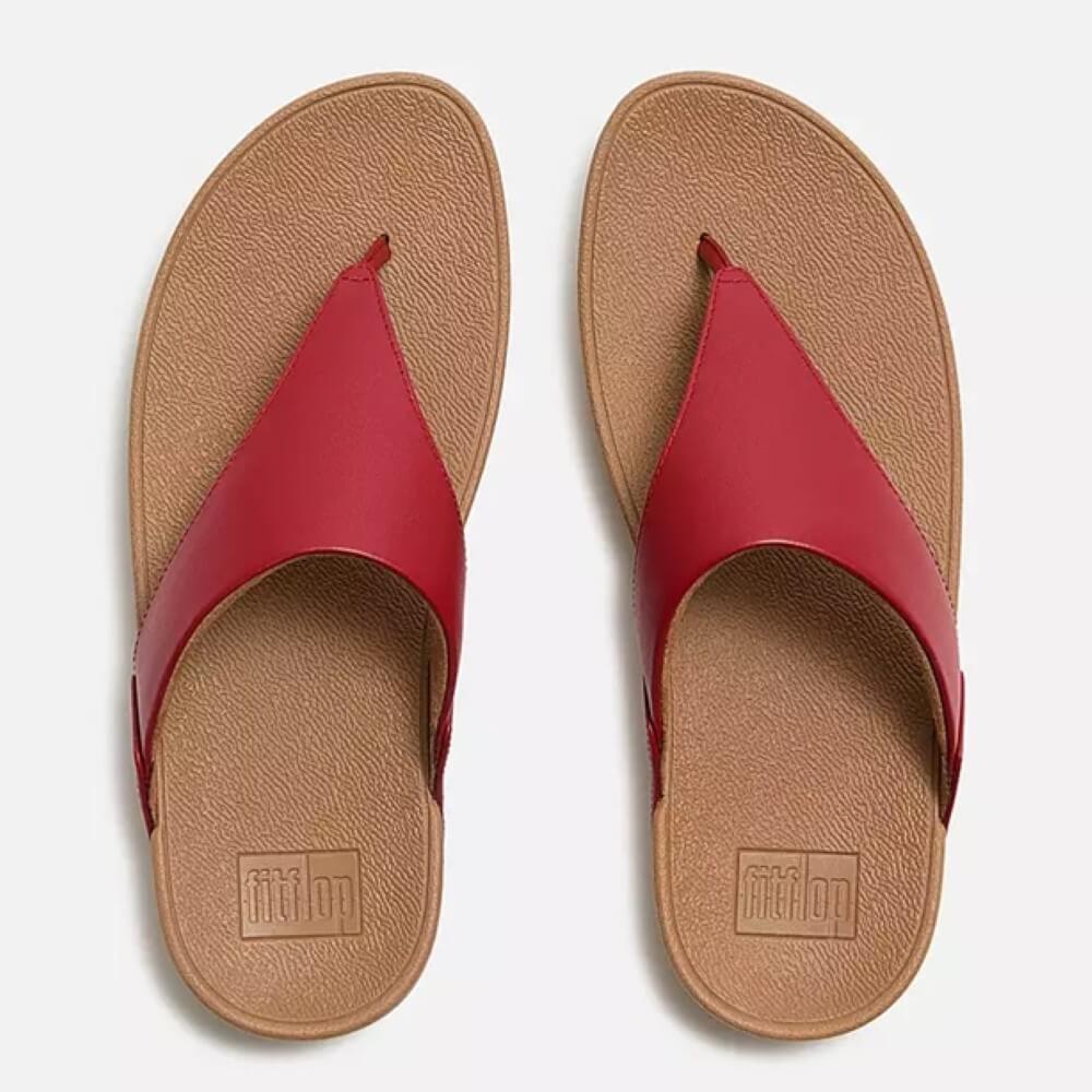 Fitflop Red sandals with a tan soles on a white background