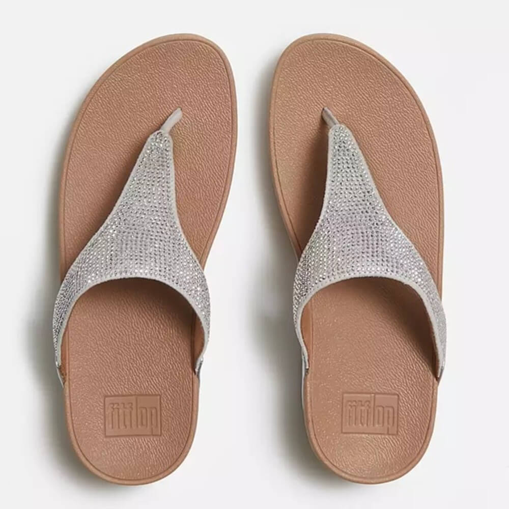Fitflop Silver sandals with brown soles on a white background