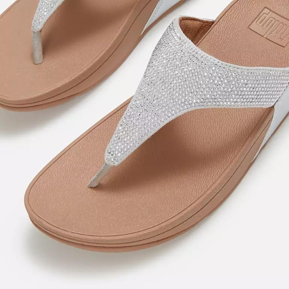 Fitflop Silver sandal with brown sole on a white background