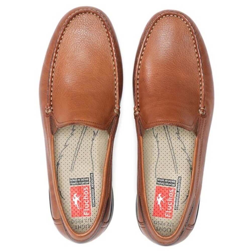 Pair of Fluchos brown leather loafers on a white background