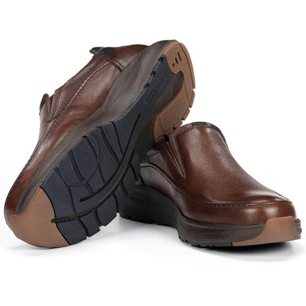 Brown slip-on shoe with black sole on a white background, featuring a waterproof label. Fluchos Triton F2064 Waterproof Leather Slip-on Nut Brown