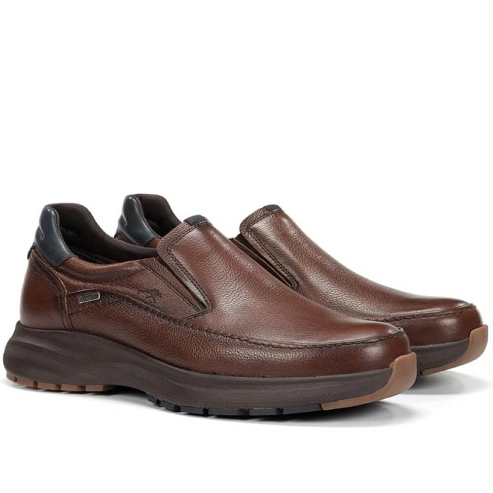 Brown slip-on shoe with black sole on a white background, featuring a waterproof label. Fluchos Triton F2064 Waterproof Leather Slip-on Nut Brown