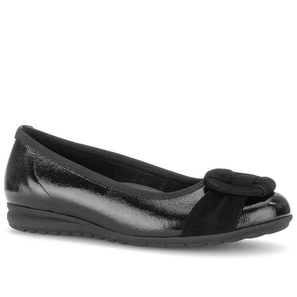 A Gabor black slip-on wedge shoe with a glossy patent leather upper, a matte black fabric bow detail across the toe, and a black sole, shown against a plain white background.