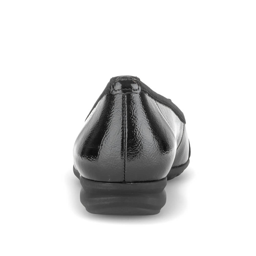 A single black patent leather flat shoe shown from a rear three-quarter view against a plain white background.