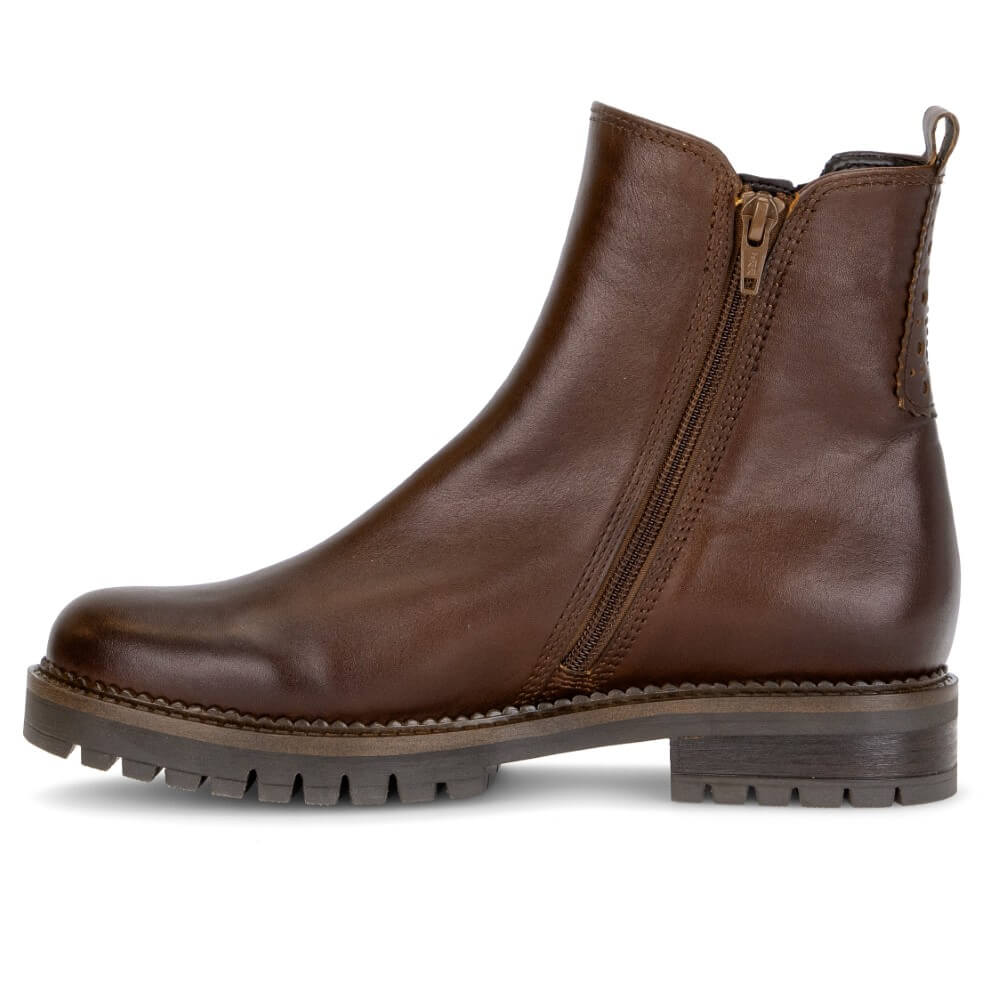A Gabor brown leather ankle boot with a side zipper, pull tab, and chunky lug sole, shown in profile against a white background.