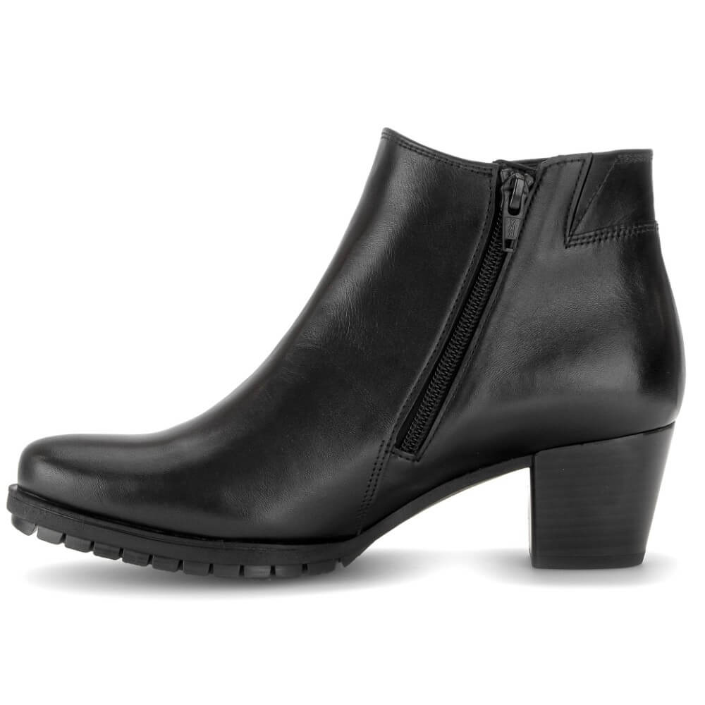 A Gabor black leather ankle boot with a side zipper, low block heel, and rounded toe, shown from a side profile on a white background.