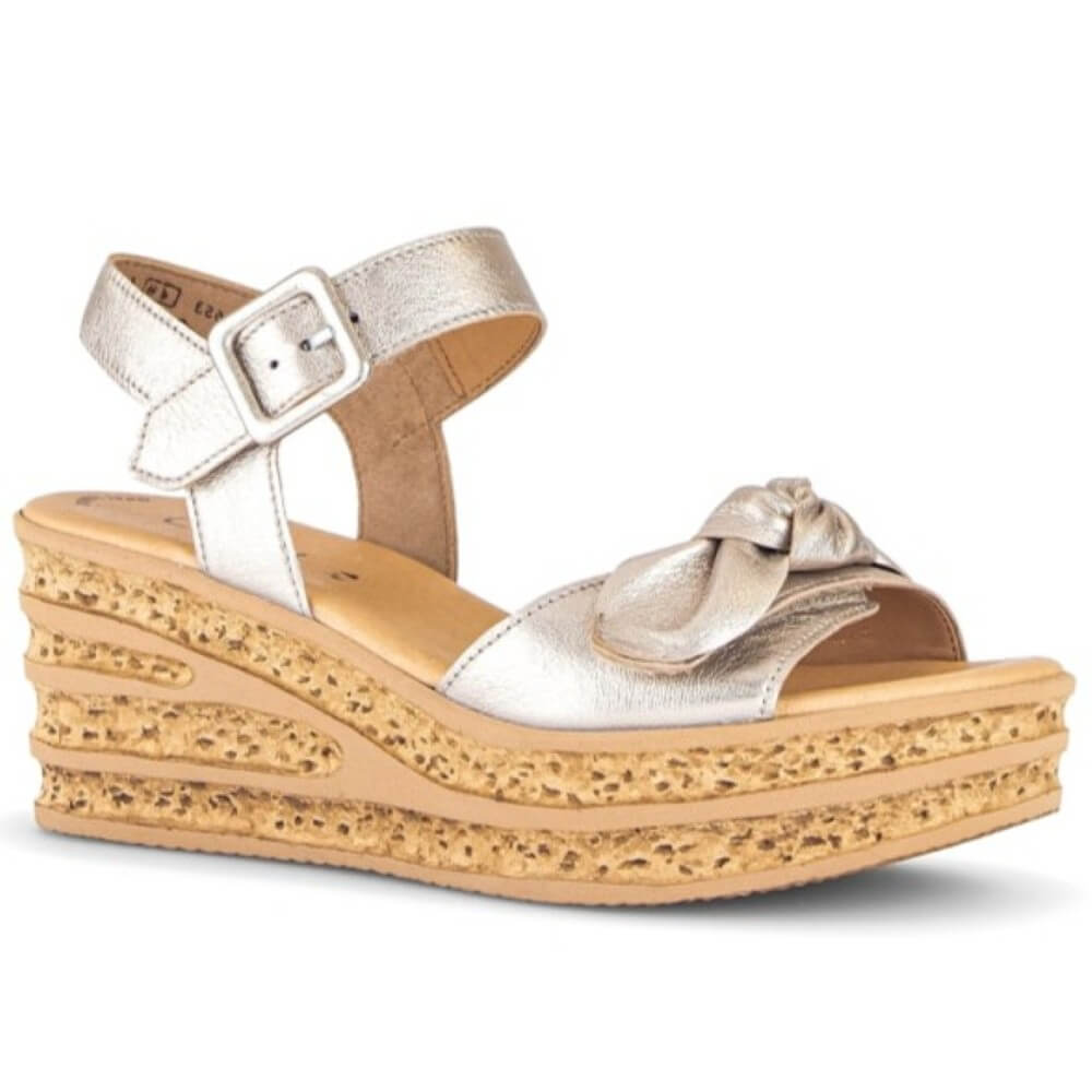 Gabor Gold wedge sandals with a bow on a white background